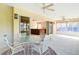 Inviting lanai with sliding door access to the living area and lush outdoor views at 2202 Kershaw Rd, The Villages, FL 32162