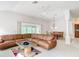 Inviting living area features a ceiling fan and opens to the dining area at 2202 Kershaw Rd, The Villages, FL 32162