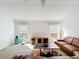 Bright living room featuring neutral carpet, light walls and expansive windows at 2202 Kershaw Rd, The Villages, FL 32162