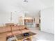 Bright living room open to the dining area and kitchen, perfect for entertaining at 2202 Kershaw Rd, The Villages, FL 32162