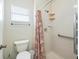 Updated bathroom with new fixtures and tiled shower, along with handrails at 2242 Orkney Dr, Leesburg, FL 34788
