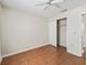 Bedroom with closet features a ceiling fan and wood parquet flooring at 2242 Orkney Dr, Leesburg, FL 34788
