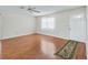 Inviting living room with gleaming hardwood floors, a ceiling fan, and a cozy ambiance at 2242 Orkney Dr, Leesburg, FL 34788