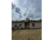Backyard view featuring solar panels, and AC units at 23130 Brouwertown Rd, Howey In The Hills, FL 34737