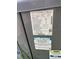 Close-up of the HVAC unit's label showing the unit's serial number, model, and manufacturing date at 23130 Brouwertown Rd, Howey In The Hills, FL 34737