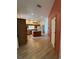 View of open kitchen with stainless steel appliances, center island, and wood-look flooring at 23130 Brouwertown Rd, Howey In The Hills, FL 34737