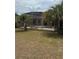 Pool and caged enclosure viewed from the back yard at 23130 Brouwertown Rd, Howey In The Hills, FL 34737