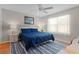 Comfortable bedroom features a ceiling fan and a bright window at 2369 Five Forks Trl, The Villages, FL 32162
