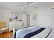 Well-lit bedroom with a white dresser and modern decor at 2369 Five Forks Trl, The Villages, FL 32162