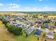An aerial view of a beautiful and expansive suburban community with lush green landscaping and well-maintained homes at 23707 Companero Dr, Sorrento, FL 32776