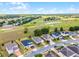 Stunning aerial view of the property and its location on a golf course at 23707 Companero Dr, Sorrento, FL 32776