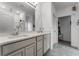 Bathroom features a double vanity and a separate tiled shower; bright and clean at 23707 Companero Dr, Sorrento, FL 32776