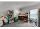 This room has carpeted floors, bunk beds with a slide, and an array of colorful toys at 23707 Companero Dr, Sorrento, FL 32776