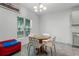 Bright dining area with a chandelier and a view of the yard at 23707 Companero Dr, Sorrento, FL 32776