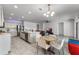 Bright, open kitchen with stainless appliances, island sink, and adjacent casual dining area at 23707 Companero Dr, Sorrento, FL 32776