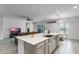 Bright and open kitchen and living space combination featuring stainless appliances and an adjacent breakfast nook at 23707 Companero Dr, Sorrento, FL 32776