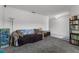 Spacious living room featuring comfortable seating and stylish shelving at 23707 Companero Dr, Sorrento, FL 32776