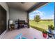 Outdoor patio with grill and seating overlooking a lush green lawn, ideal for entertaining at 23707 Companero Dr, Sorrento, FL 32776