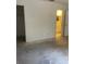 Bright bedroom with neutral walls and a bathroom featuring vanity with storage at 2421 Centennial Blvd, Leesburg, FL 34748