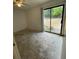 Bedroom features a sliding glass door and ceiling fan at 2421 Centennial Blvd, Leesburg, FL 34748