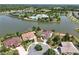 Aerial view showing property boundaries, lake, and community amenities at 2457 Bar Harbor, Mount Dora, FL 32757