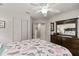 Spacious bedroom features a dark wood dresser and seashell patterned quilt at 2457 Bar Harbor, Mount Dora, FL 32757
