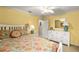 Comfortable bedroom boasts a striped headboard and a floral-patterned quilt on the bed at 2457 Bar Harbor, Mount Dora, FL 32757