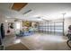 Spacious garage featuring ample storage space, work area, and canoe at 2457 Bar Harbor, Mount Dora, FL 32757