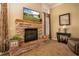 Stone fireplace with a TV and elegant decorations. The perfect place to relax at 2457 Bar Harbor, Mount Dora, FL 32757