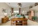 Cozy living room with stylish furnishings, a ceiling fan, and an open layout, perfect for relaxation and entertainment at 2457 Bar Harbor, Mount Dora, FL 32757