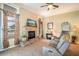 The living room features a fireplace with a large screen TV and comfortable seating at 2457 Bar Harbor, Mount Dora, FL 32757