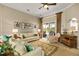 Bright living room with comfortable seating, a decorative rug, and a view to the outdoor screened patio at 2457 Bar Harbor, Mount Dora, FL 32757