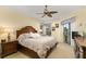 A main bedroom featuring neutral decor, crown molding, and a ceiling fan at 2457 Bar Harbor, Mount Dora, FL 32757