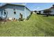 Expansive backyard with lush green grass and trees at 24841 Pine Hl, Leesburg, FL 34748