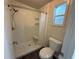Bathroom featuring accessible shower, toilet, and neutral finishes at 24841 Pine Hl, Leesburg, FL 34748