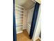 Walk-in closet with custom shelving and built in drawers at 24841 Pine Hl, Leesburg, FL 34748