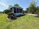 Landscaped yard of home featuring tropical foliage at 24841 Pine Hl, Leesburg, FL 34748