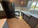 Kitchen with lazy susan, stainless steel appliances and farm sink at 24841 Pine Hl, Leesburg, FL 34748