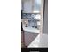 Gray cabinets with white countertops and backsplash complement a decorative storage area at 24841 Pine Hl, Leesburg, FL 34748