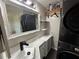 Modern laundry room with updated machines, vanity, and organized shelves at 24841 Pine Hl, Leesburg, FL 34748