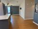 Open-concept living room featuring wood floors and modern fixtures at 24841 Pine Hl, Leesburg, FL 34748