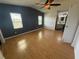 Spacious main bedroom features two windows and a ceiling fan at 24841 Pine Hl, Leesburg, FL 34748