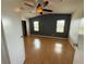 Main bedroom featuring two windows, and wood laminate floors at 24841 Pine Hl, Leesburg, FL 34748
