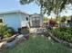 Backyard shed with landscaping and flowers at 24841 Pine Hl, Leesburg, FL 34748