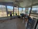 Enclosed sunroom area with large windows and natural light at 24841 Pine Hl, Leesburg, FL 34748