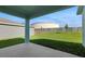 View of the expansive backyard from the covered back patio at 2860 Supermarine Rd, Tavares, FL 32778