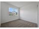 Neutral bedroom with carpet flooring, natural light and white walls at 2860 Supermarine Rd, Tavares, FL 32778