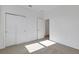 Bedroom with plush carpet, closet and natural light at 2860 Supermarine Rd, Tavares, FL 32778