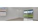 Spacious bedroom with sliding glass doors leading to the backyard at 2860 Supermarine Rd, Tavares, FL 32778