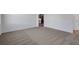 Spacious bedroom featuring neutral carpet, light walls, and an ensuite bathroom at 2860 Supermarine Rd, Tavares, FL 32778